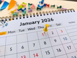 A calendar showing a yellow push pin on January 1st, 2026.